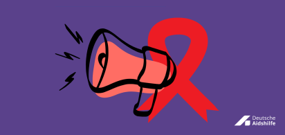 Megafon und rote Schleife